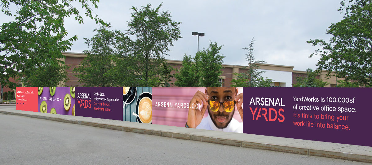 Arsenal Yards fence banner